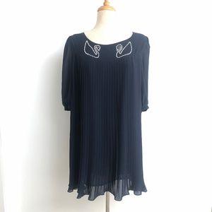 Pleated navy dress with pearl detail